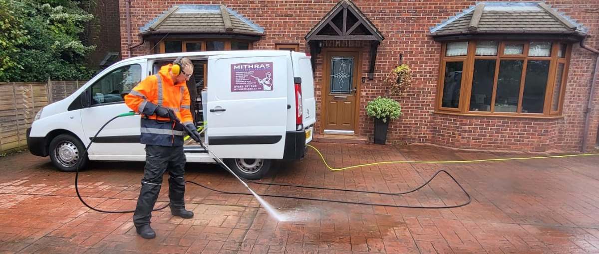 Pressure washing a driveway